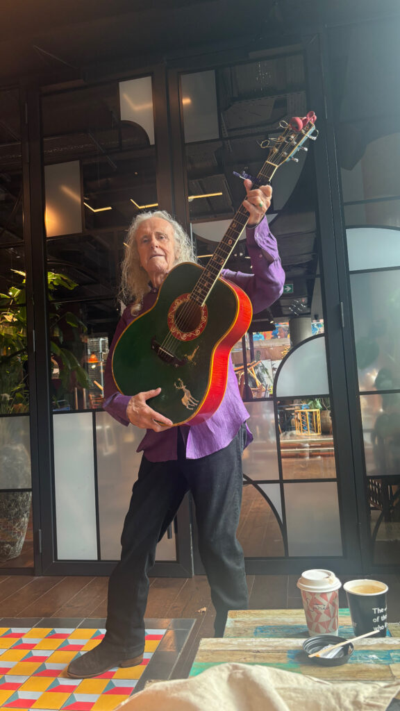 Donovan holding his guitar named Kelly